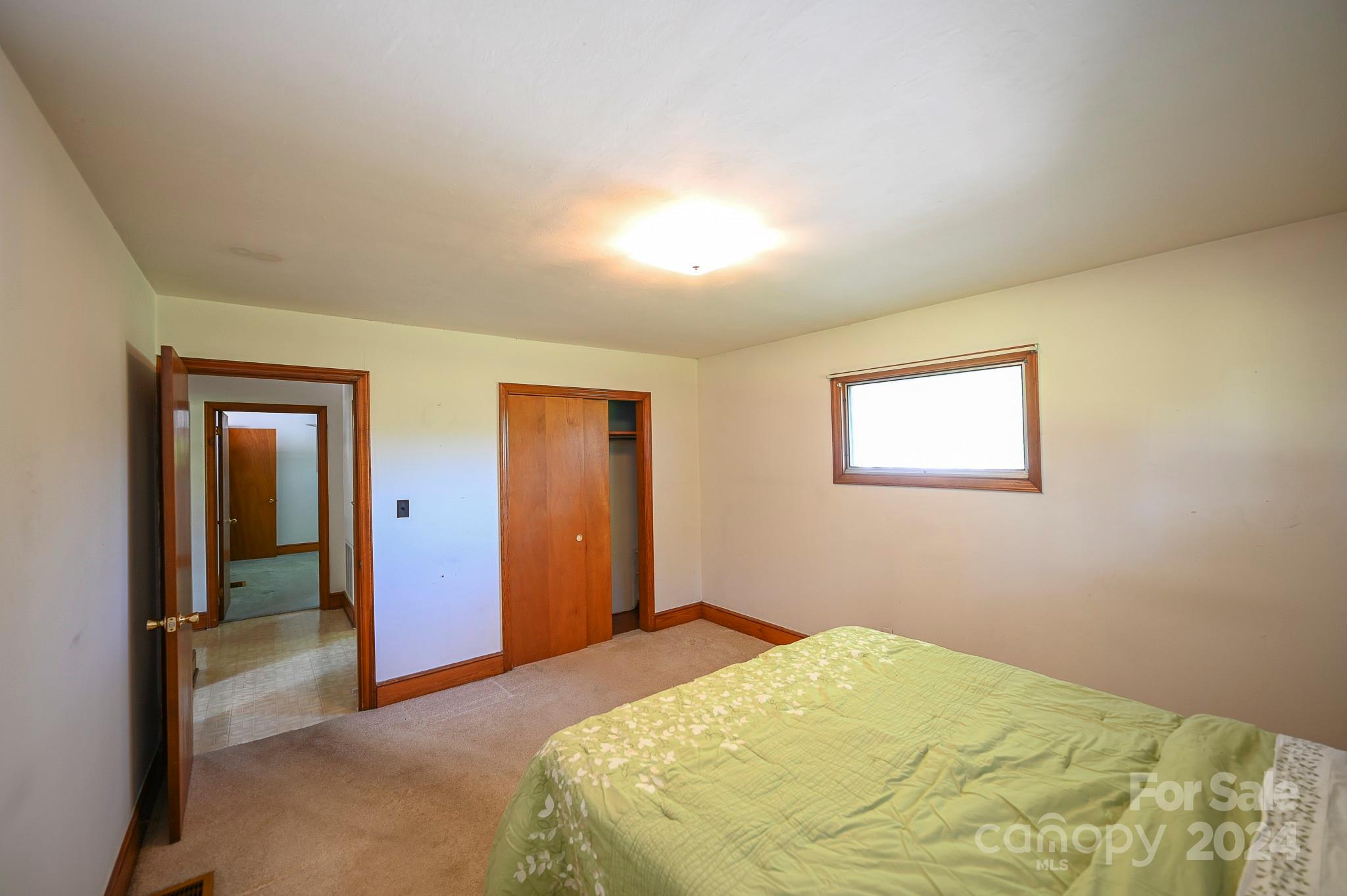 774 Poors Ford Road Rutherfordton, NC 28139 - Photo 18 of 25 a bedroom with a bed and a painting on the wall
