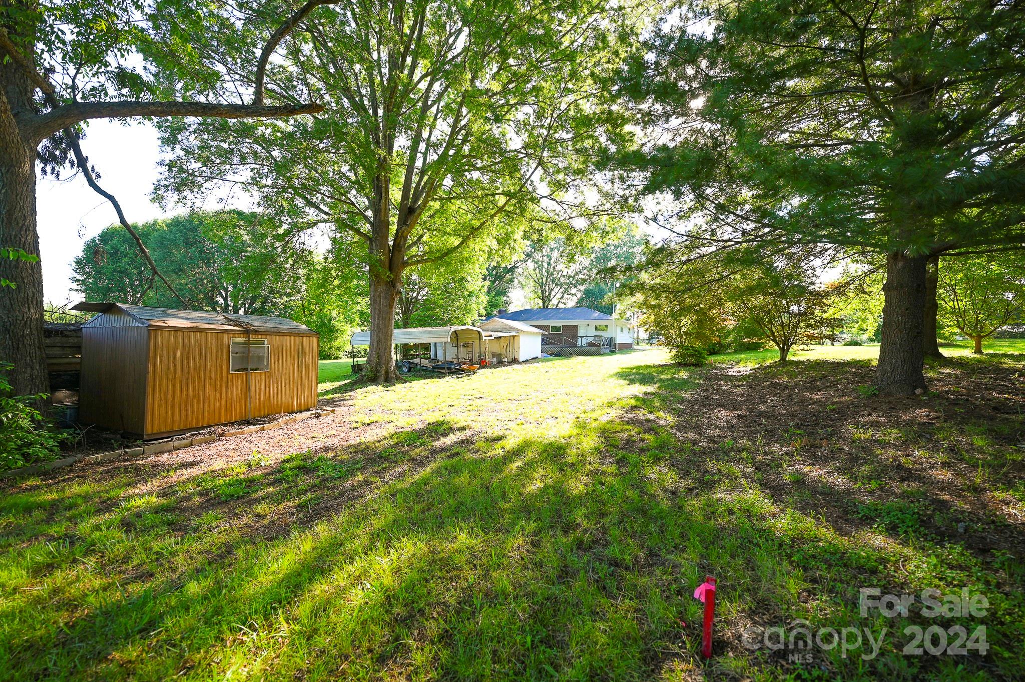 774 Poors Ford Road Rutherfordton, NC 28139 - Photo 5 of 25 a backyard of a house with lots of green space