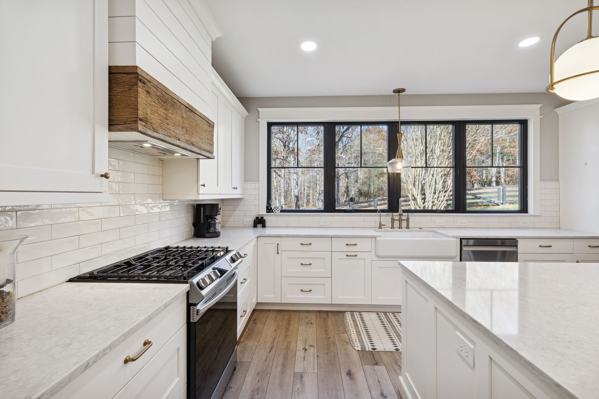7340 Bradford Road Primm Springs, TN 38476 - Photo 13 of 36 a kitchen with a sink stove top oven and cabinets