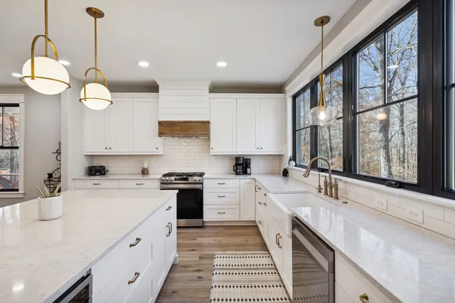 a kitchen with a sink stove and cabinets
