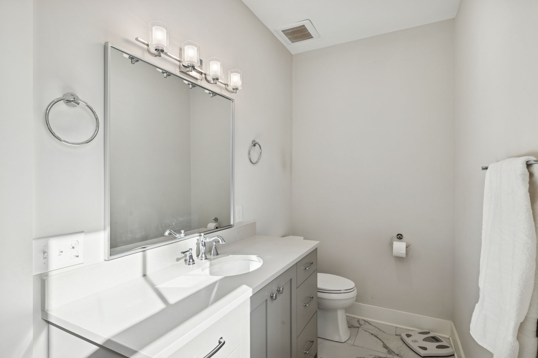 7340 Bradford Road Primm Springs, TN 38476 - Photo 18 of 36 a bathroom with a granite countertop toilet sink and mirror
