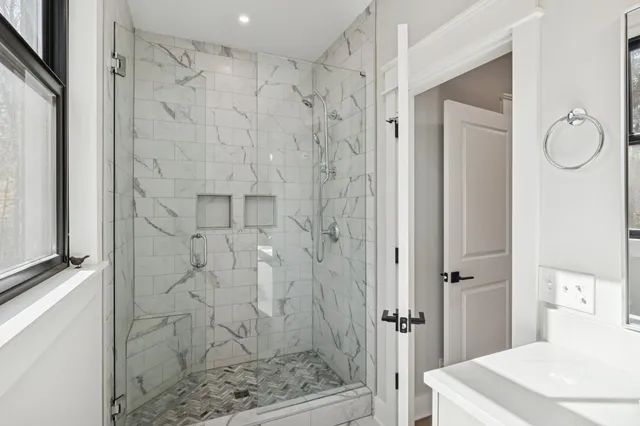 a bathroom with a shower and a sink