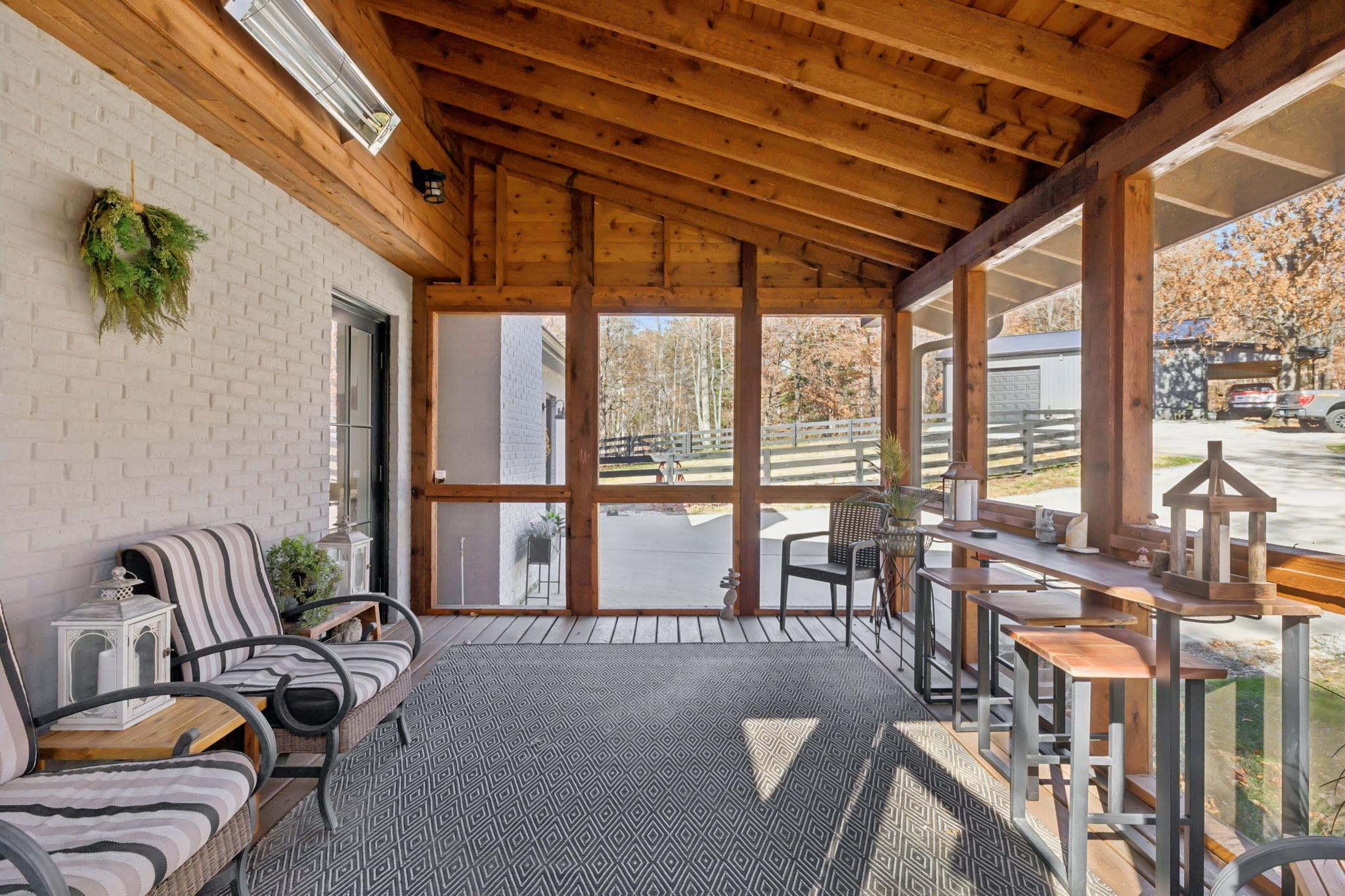 7340 Bradford Road Primm Springs, TN 38476 - Photo 26 of 36 a living room with furniture and floor to ceiling windows