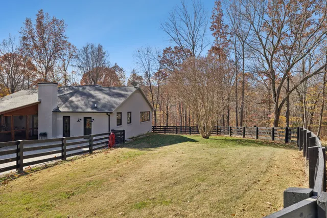 a house that has a tree in front of it