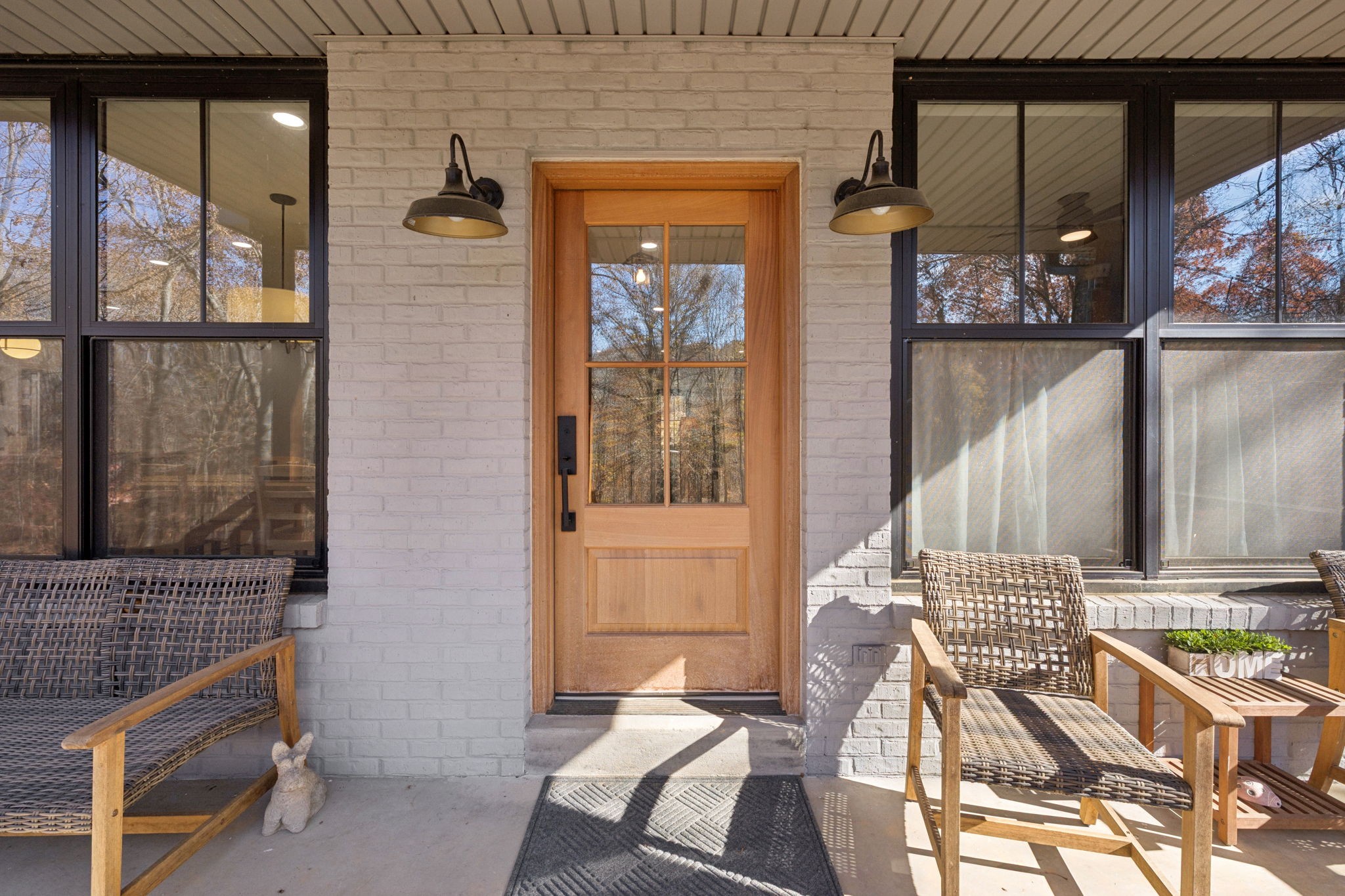 7340 Bradford Road Primm Springs, TN 38476 - Photo 31 of 36 a view of a balcony with chairs and floor to ceiling window