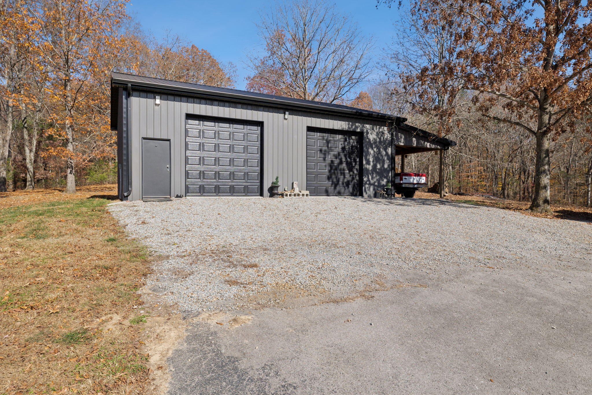 7340 Bradford Road Primm Springs, TN 38476 - Photo 36 of 36 a view of a house with a outdoor space and shower