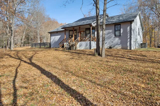 a view of a house with snow on the road