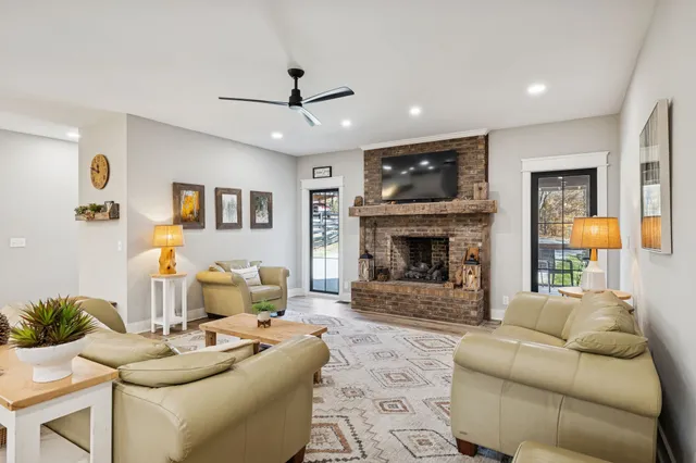 a living room with furniture and a fireplace