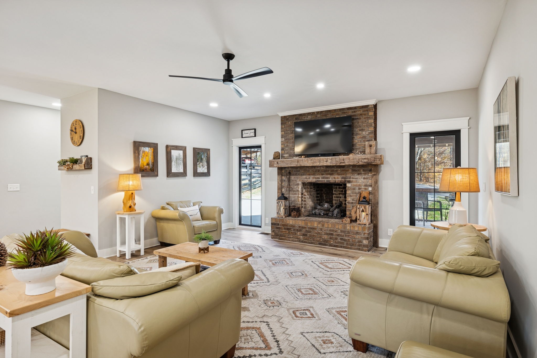 7340 Bradford Road Primm Springs, TN 38476 - Photo 7 of 36 a living room with furniture and a fireplace