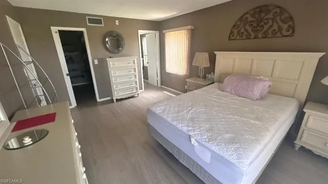a bedroom with a bed and furniture