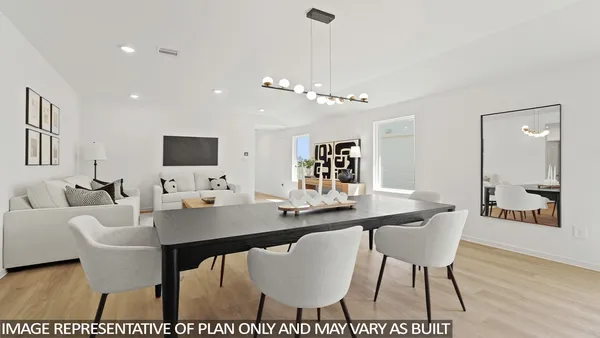 a living room with lots of furniture and a table