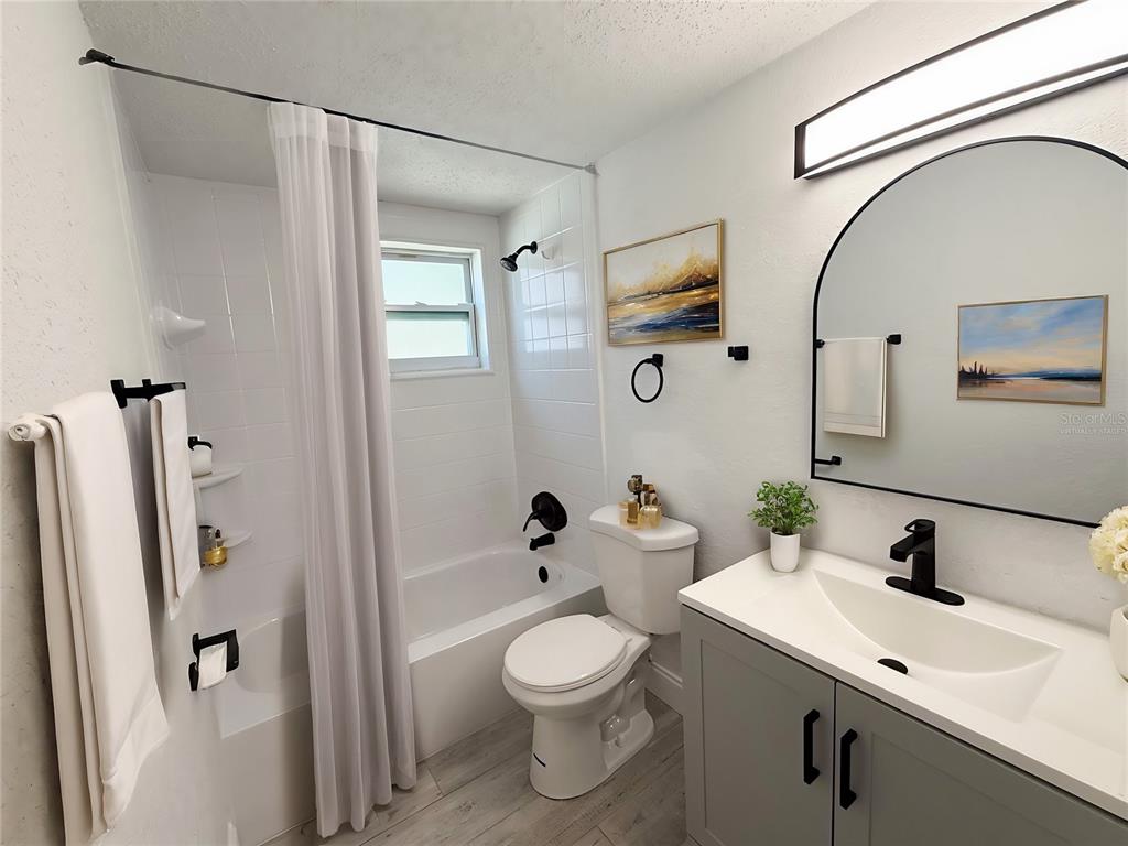 6834 Amarillo Street Port Richey, FL 34668 - Photo 11 of 31 Virtually Staged Main Bathroom