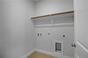 a view of storage and utility room with racks on the wall