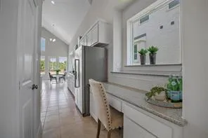 a kitchen with stainless steel appliances granite countertop a refrigerator and a counter top space