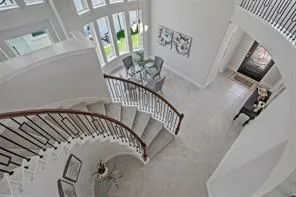 a view of staircase with a rug
