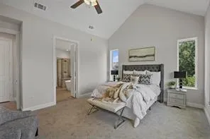 a bedroom with bed and a chandelier