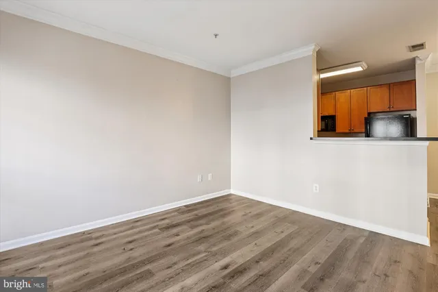 a kitchen with stainless steel appliances granite countertop a sink and a wooden cabinets