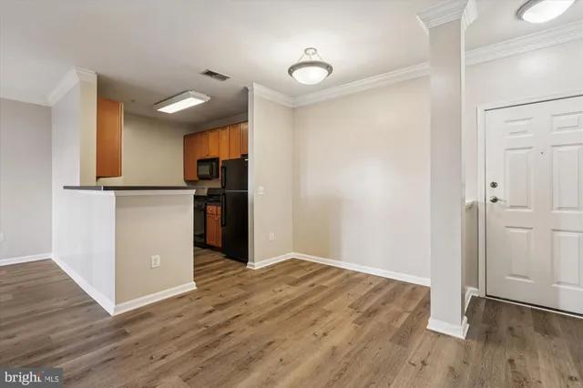 a kitchen with a sink and a refrigerator