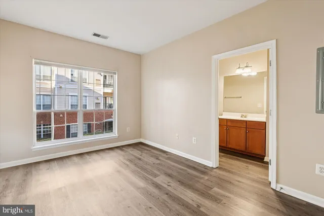 a view of wooden floor in an empty room