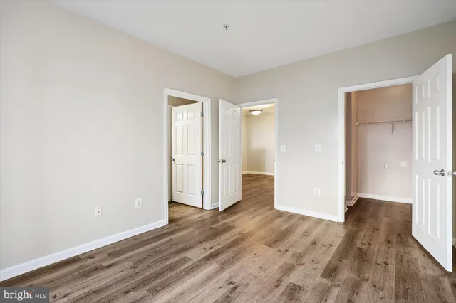 a bathroom with a sink toilet vanity and shower