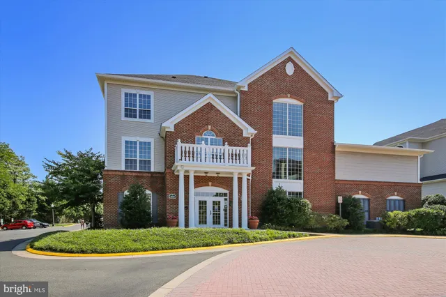 a room with furniture pool table and windows