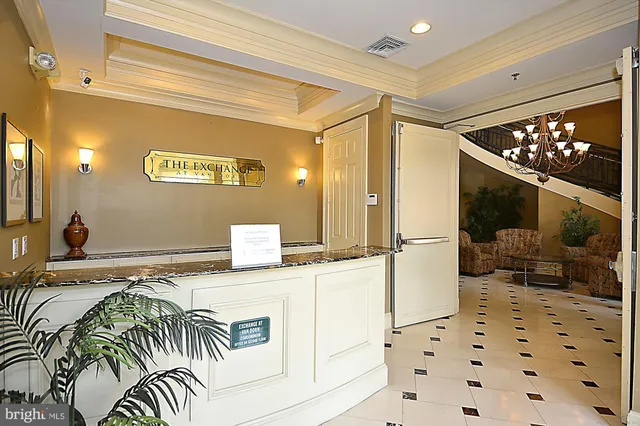 a living room with furniture a fireplace and a large window