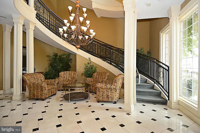 a view of a livingroom with workspace and a window