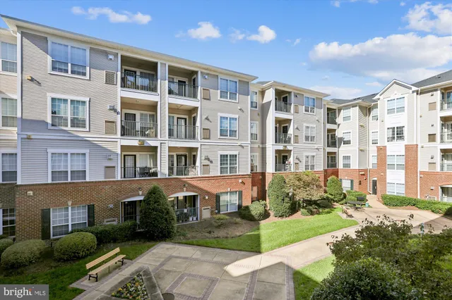 a front view of a building with garden