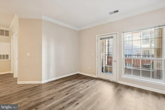 a view of a kitchen with wooden floor