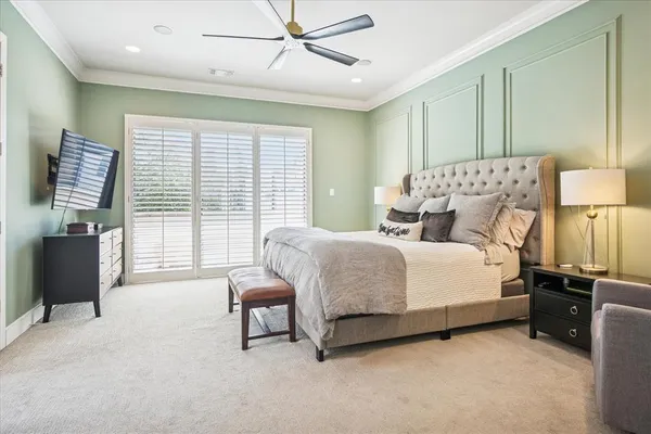 a bedroom with a bed and a lamp