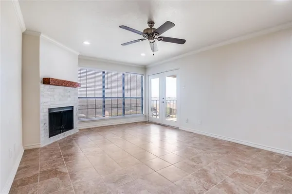 a view of an empty room with a fireplace
