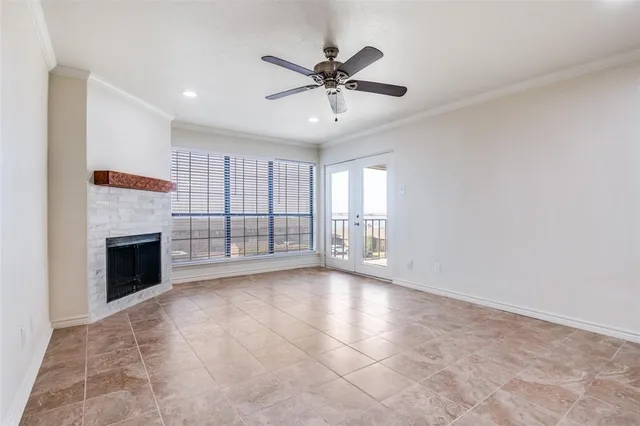 a view of an empty room with a fireplace