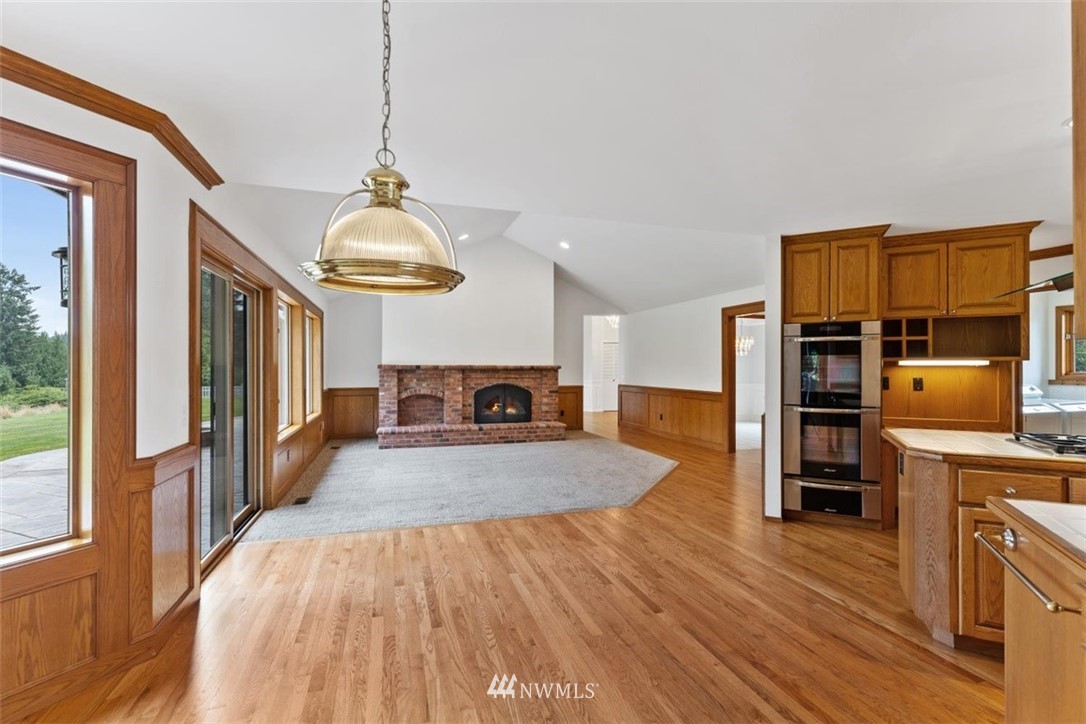 4801 166th Place Southeast Bothell, WA 98012 - Photo 16 of 40 a view of a kitchen with a sink and a refrigerator