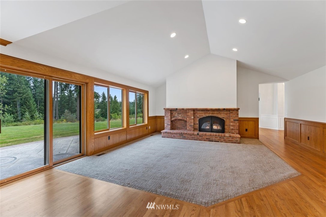 4801 166th Place Southeast Bothell, WA 98012 - Photo 17 of 40 a view of livingroom with furniture and a fireplace