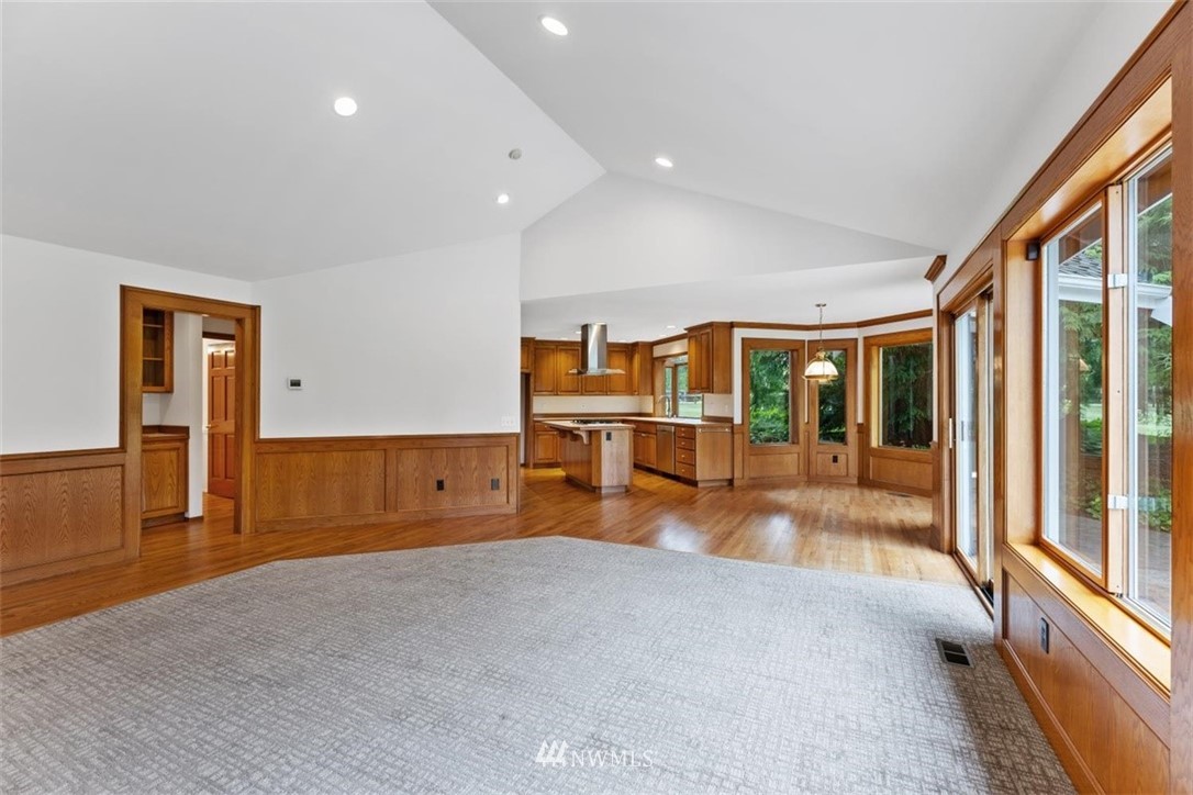 4801 166th Place Southeast Bothell, WA 98012 - Photo 19 of 40 a view of empty room with wooden floor and fan