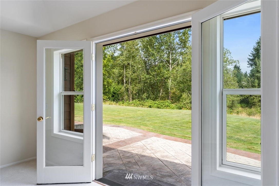 4801 166th Place Southeast Bothell, WA 98012 - Photo 22 of 40 a view of a room that has a large window and front view of a house