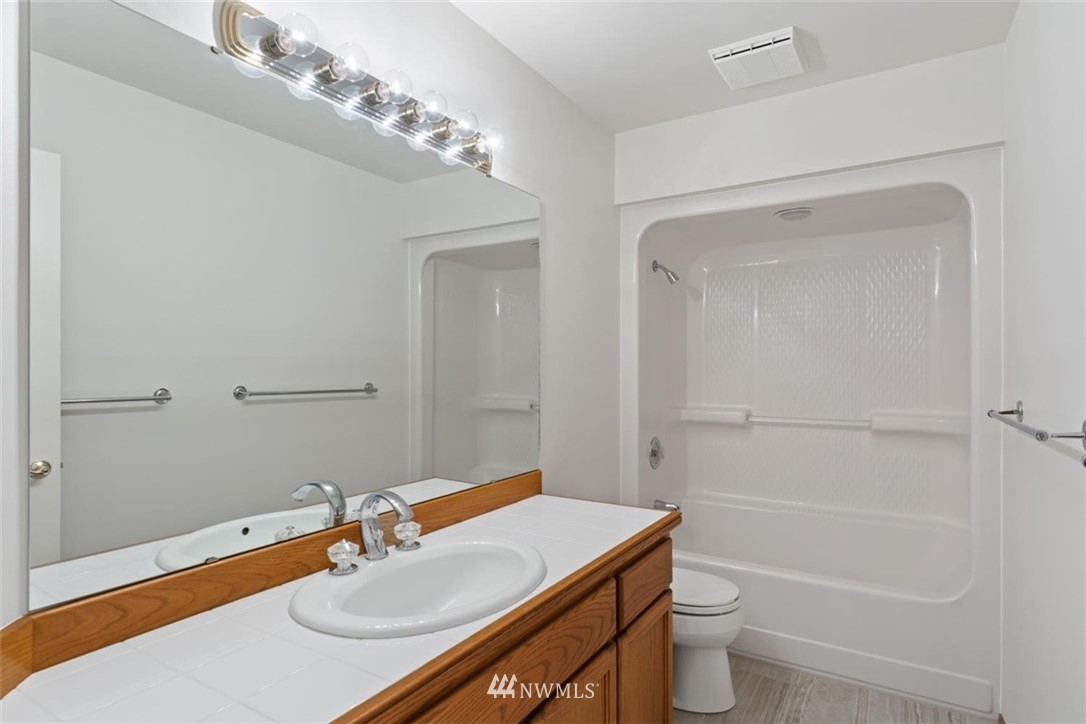 4801 166th Place Southeast Bothell, WA 98012 - Photo 29 of 40 a bathroom with a sink toilet and shower