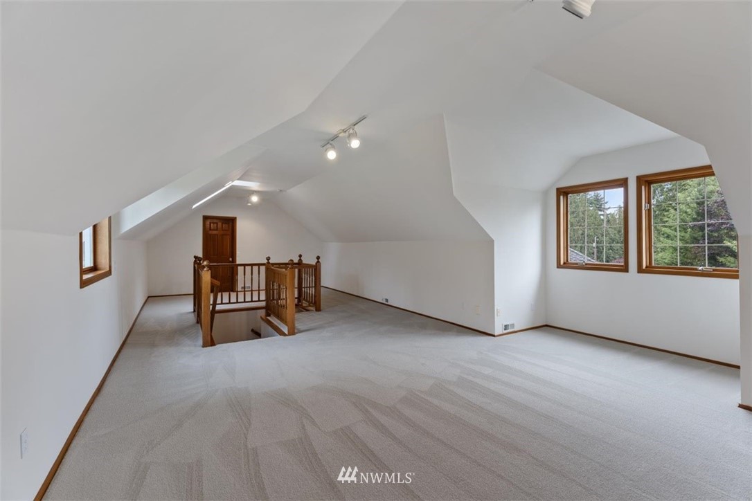 4801 166th Place Southeast Bothell, WA 98012 - Photo 32 of 40 a view of an empty room with window and stairs
