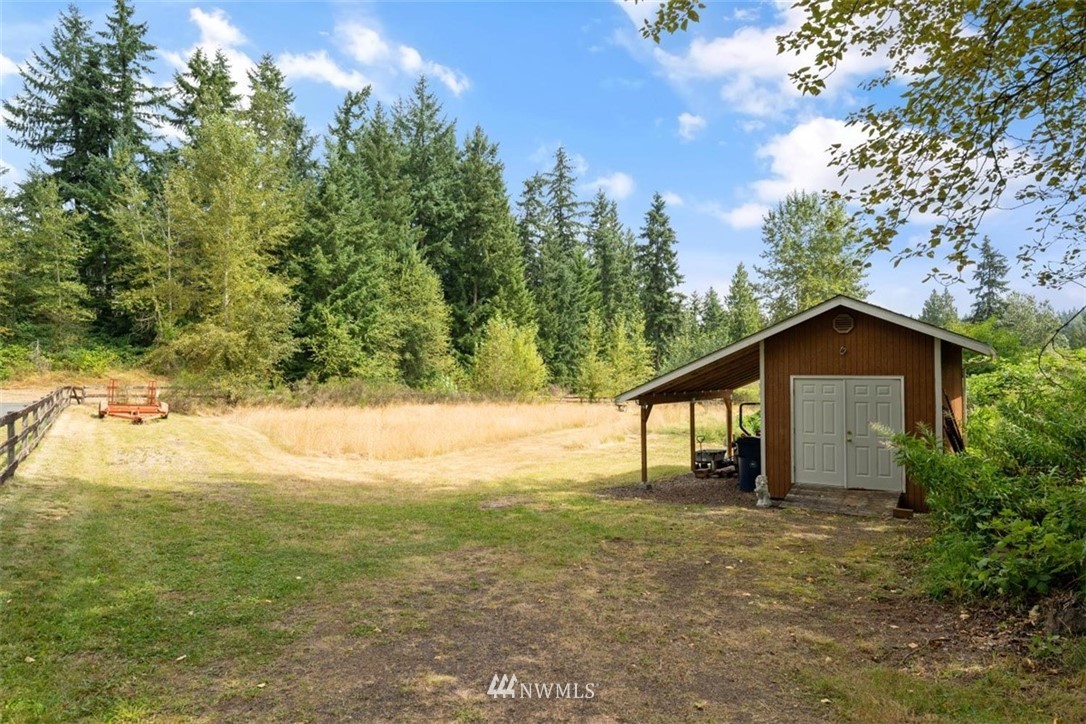 4801 166th Place Southeast Bothell, WA 98012 - Photo 37 of 40 a view of an house with backyard space and garden