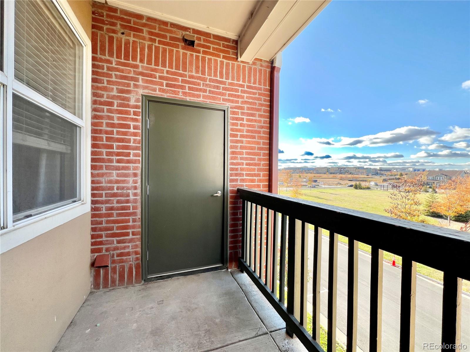 8467 Canyon Rim Circle, Unit 303 Parker, CO 80134 - Photo 17 of 17 a view of a balcony with an ocean view