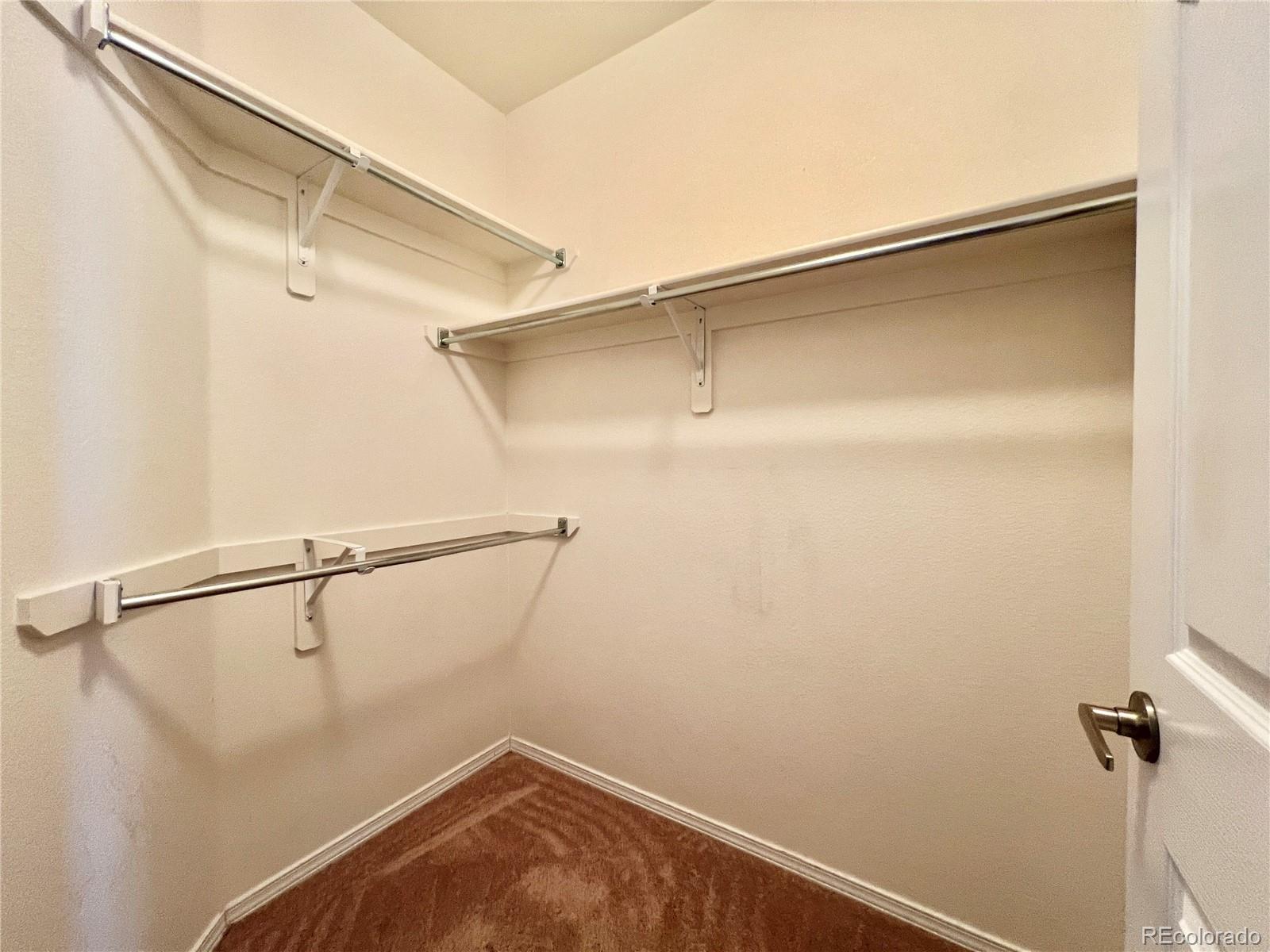 8467 Canyon Rim Circle, Unit 303 Parker, CO 80134 - Photo 7 of 17 a view of a room with racks on the wall