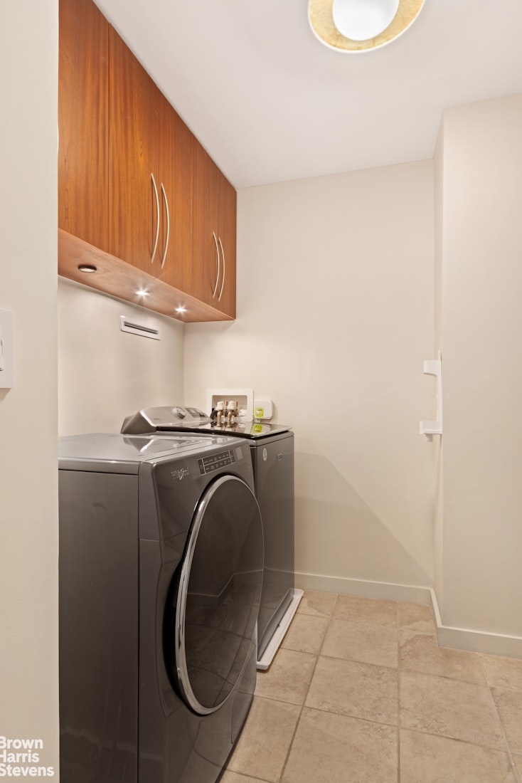 2373 Broadway, Unit 510/509 Manhattan, NY 10024 - Photo 6 of 9 a utility room with dryer and washer