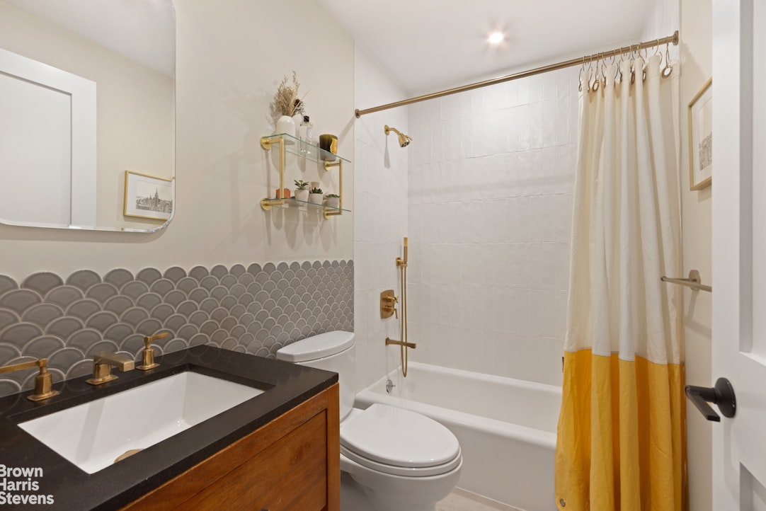 2373 Broadway, Unit 510/509 Manhattan, NY 10024 - Photo 8 of 9 a bathroom with a sink toilet and shower