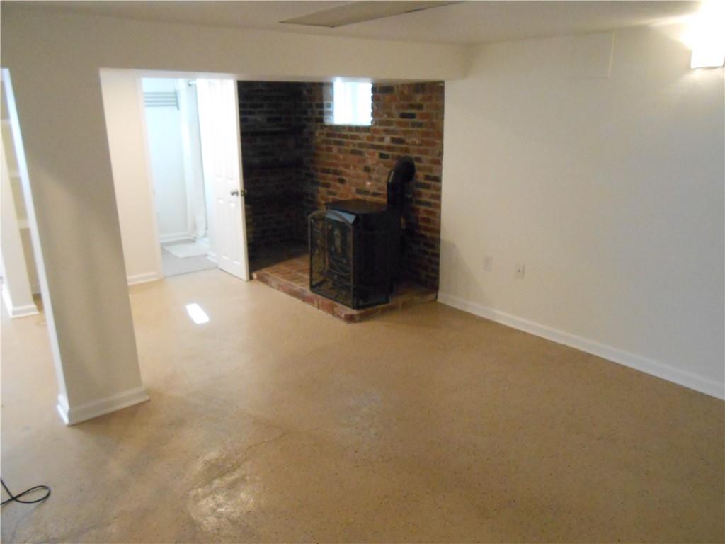 1318 Oakridge Road McDonald, PA 15057 - Photo 20 of 30 Basement with Wood Stove
