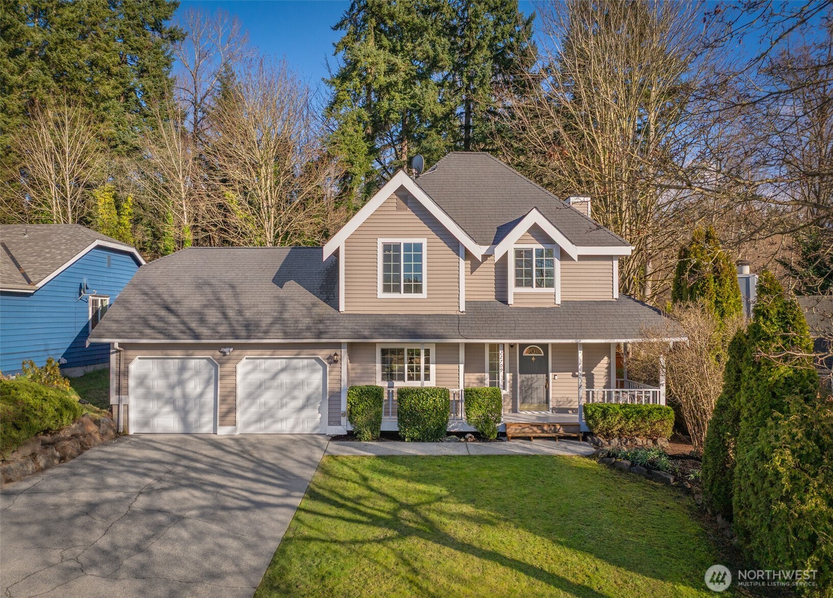22709 12th Place West Bothell, WA 98021 - Photo 23 of 27 a front view of a house with a yard