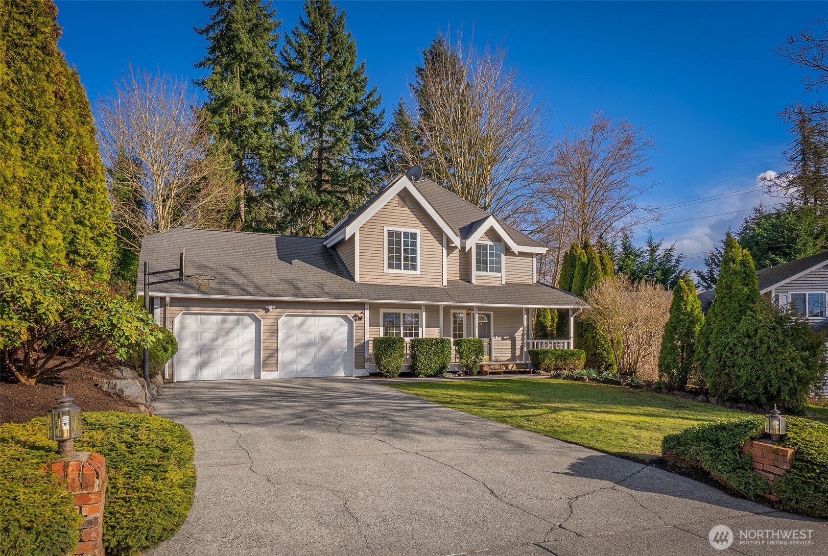 22709 12th Place West Bothell, WA 98021 - Photo 24 of 27 a front view of a house with a yard and garage