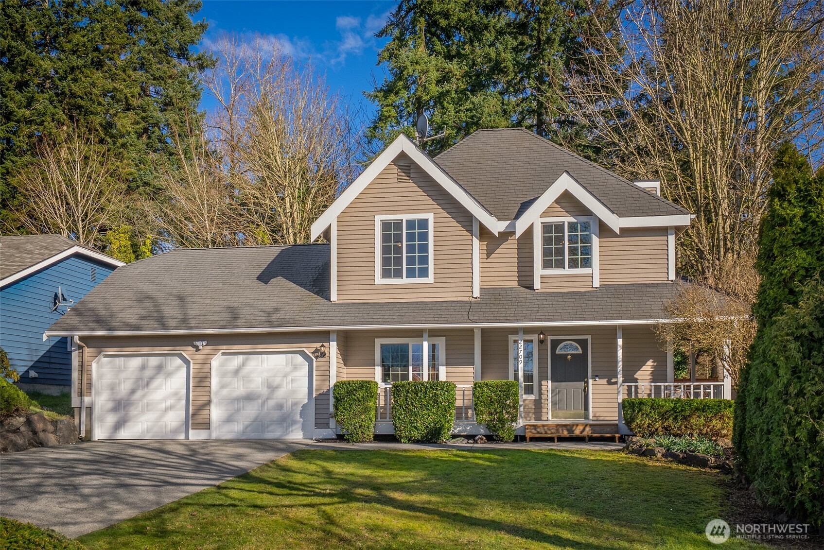 22709 12th Place West Bothell, WA 98021 - Photo 25 of 27 a front view of a house with a yard and garage