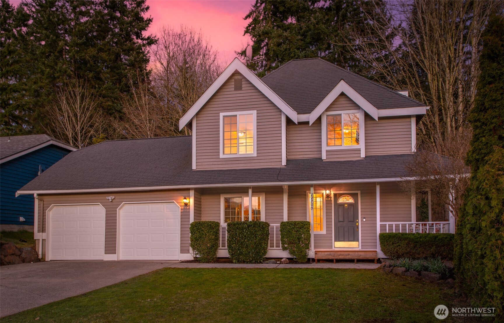 22709 12th Place West Bothell, WA 98021 - Photo 27 of 27 a front view of a house with a yard and garage