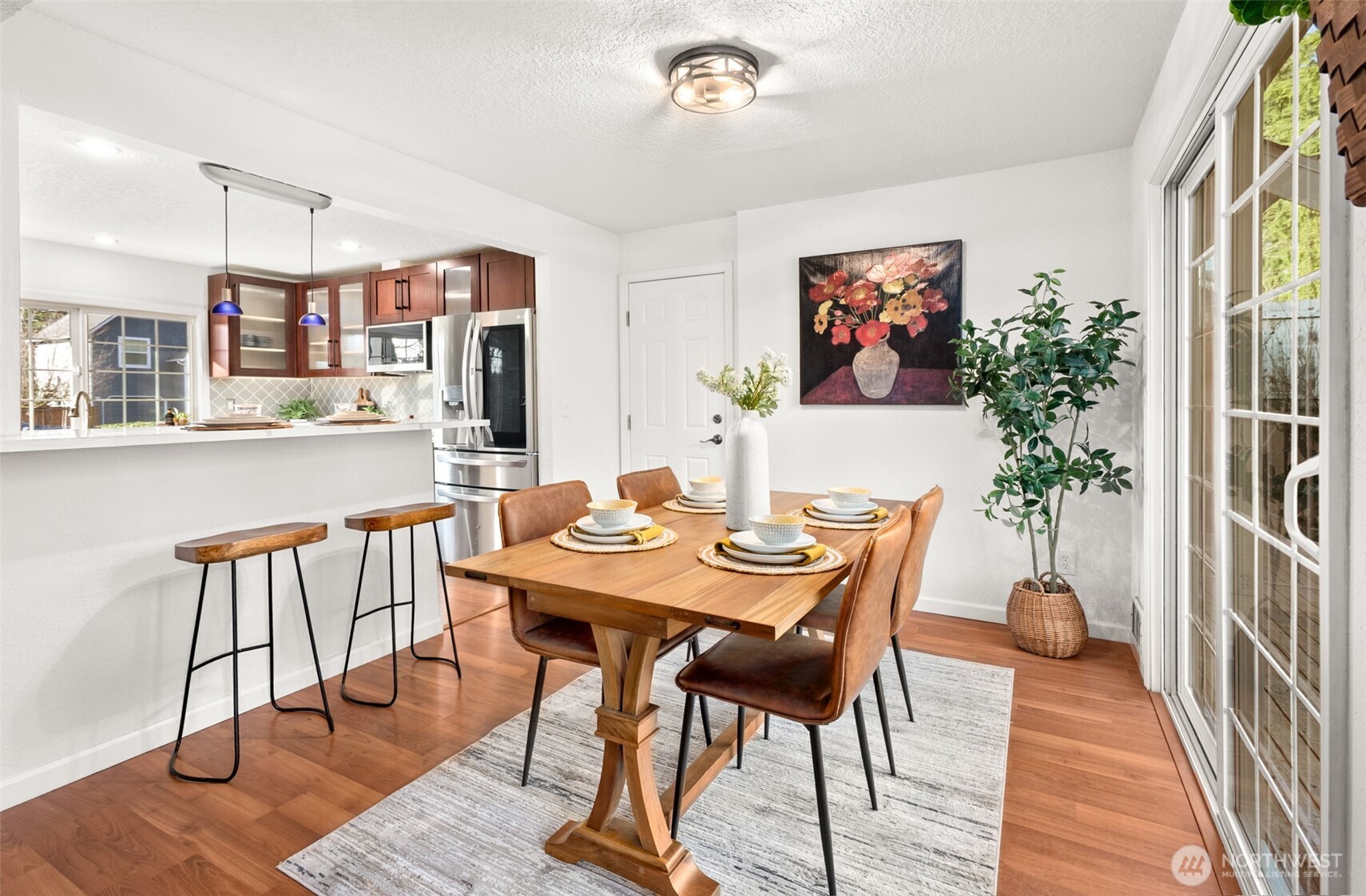 22709 12th Place West Bothell, WA 98021 - Photo 4 of 27 a view of a dining room with furniture and wooden floor