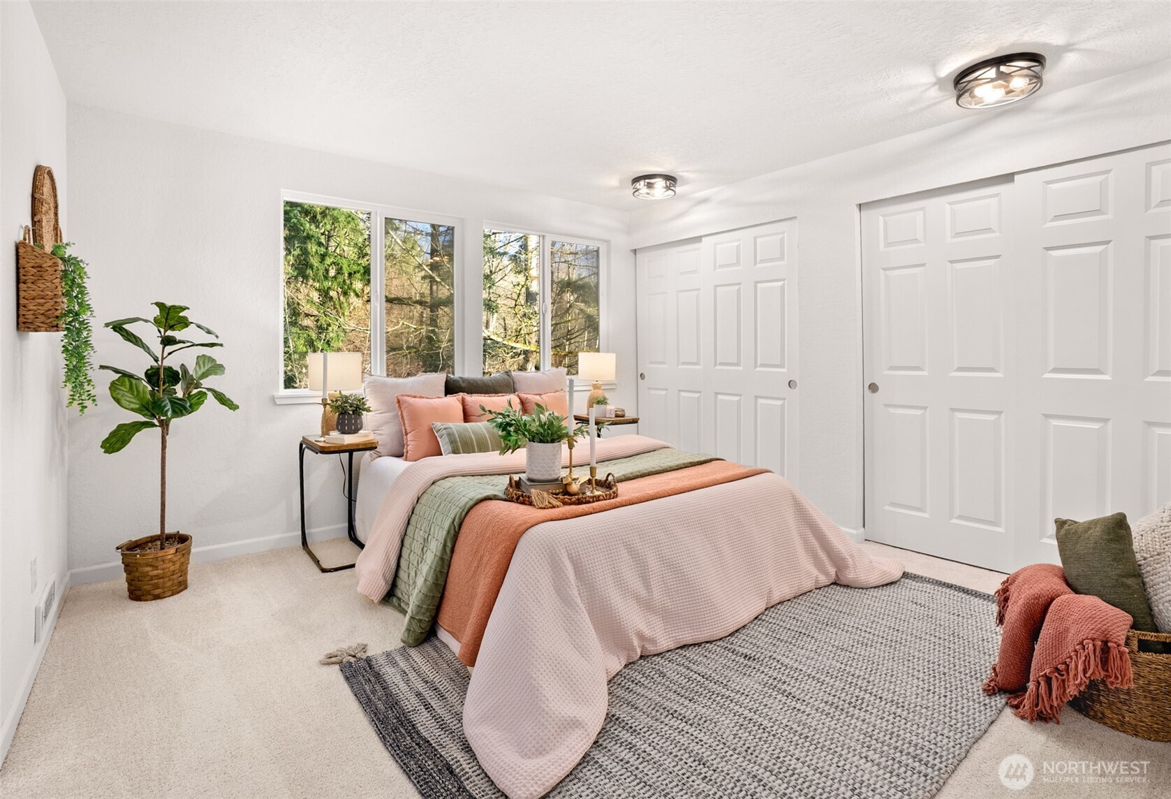 22709 12th Place West Bothell, WA 98021 - Photo 9 of 27 a bedroom with a bed and a potted plant
